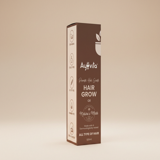 Ayuvita Hair Grow oil packaging on a green background